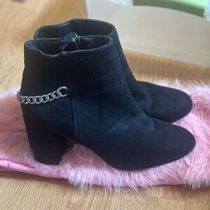 Black suede with chain booties . Very comfortable gentle used . Out the box